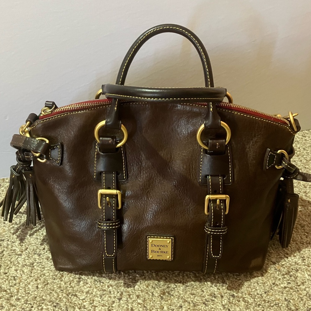 20 Dooney Bourke brown leather satchel with tassels.